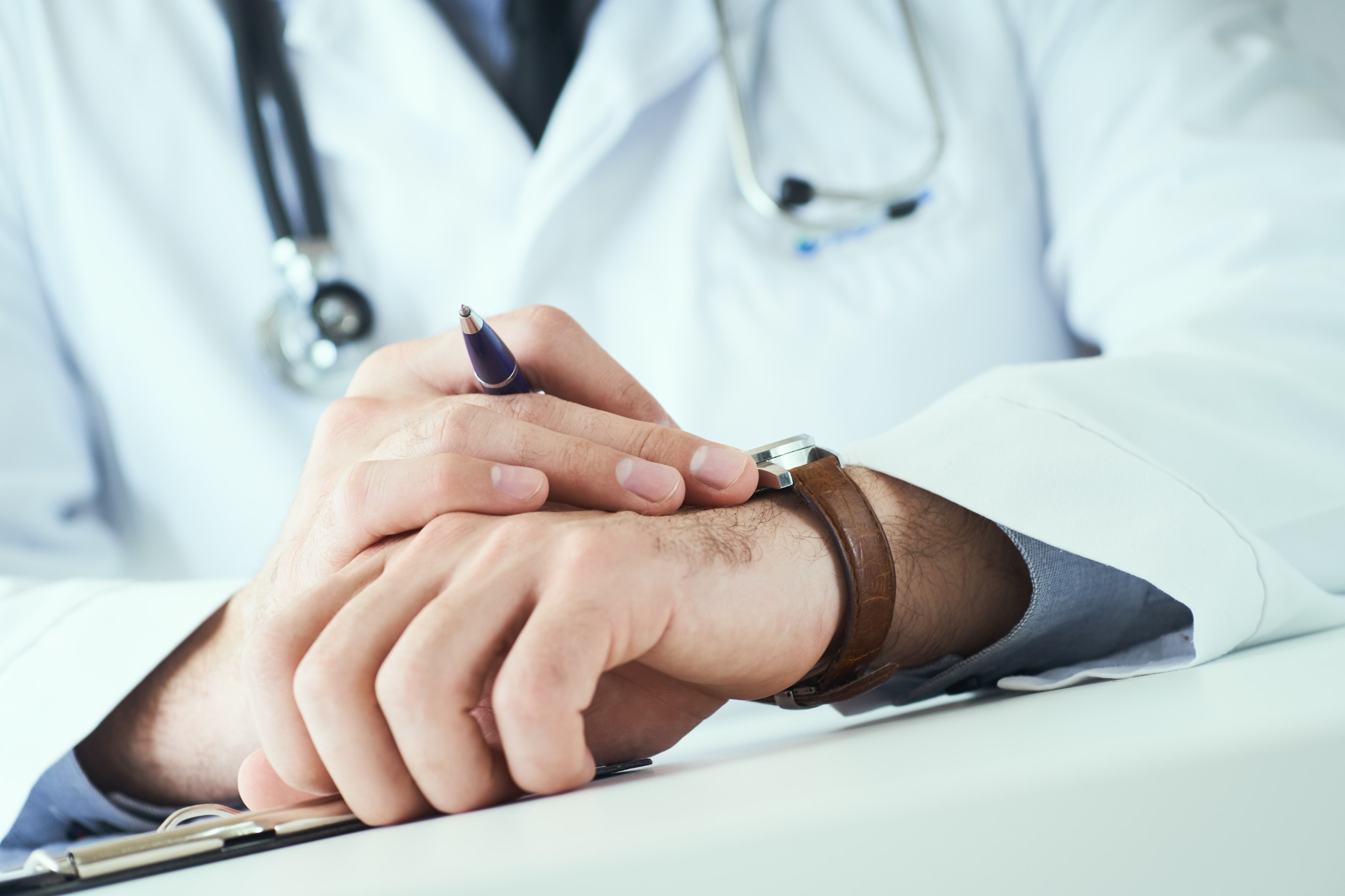Doctor checking watch
