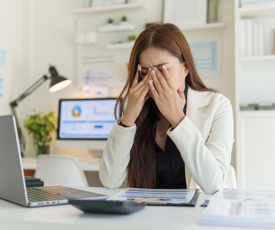 Stressed veterinary staff member overwhelmed by paperwork and administrative tasks
